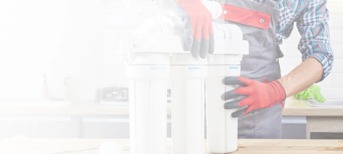 Person wearing gloves holding a white container in a kitchen setting